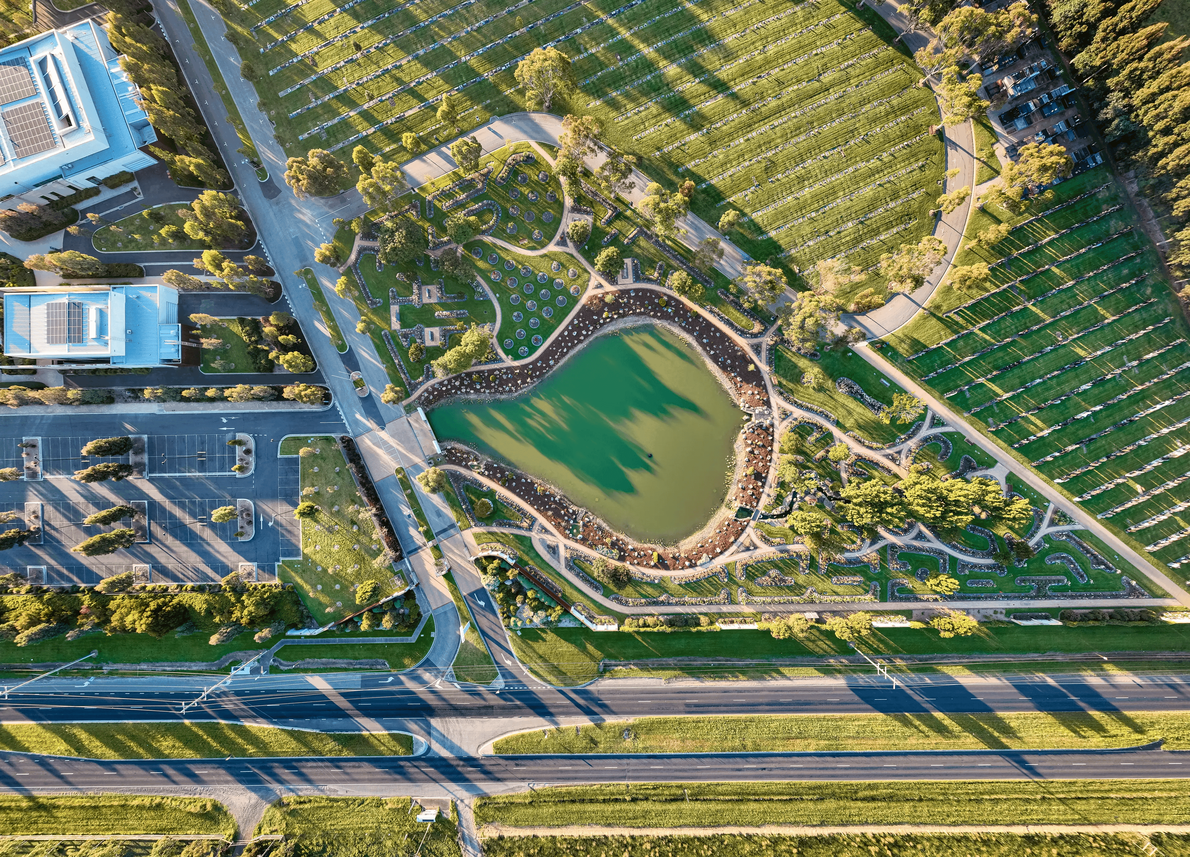 Aerial view of genesis lake and surrounding gravesite areas at Bunurong Memorial Park