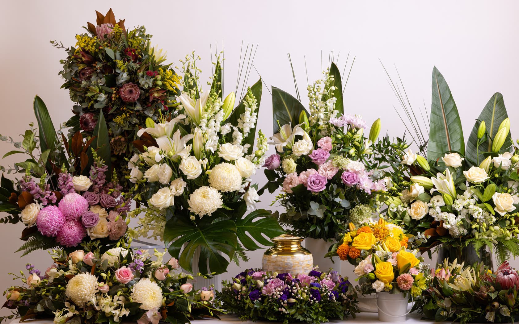Vibrant display of fresh seasonal flowers arranged by SMCT florist, featuring roses, lilies, and native blooms for all occasions including funerals