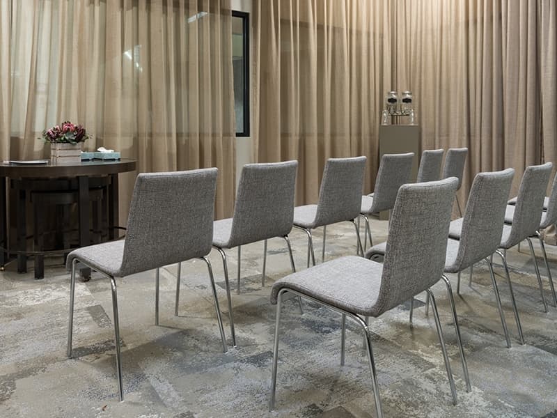 Private cremation witness viewing room with seating and serene decor, offering families a respectful space for final goodbyes